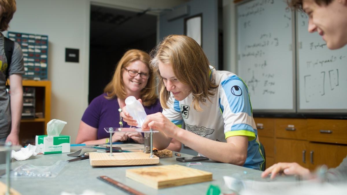 Students in classroom building a small structure 